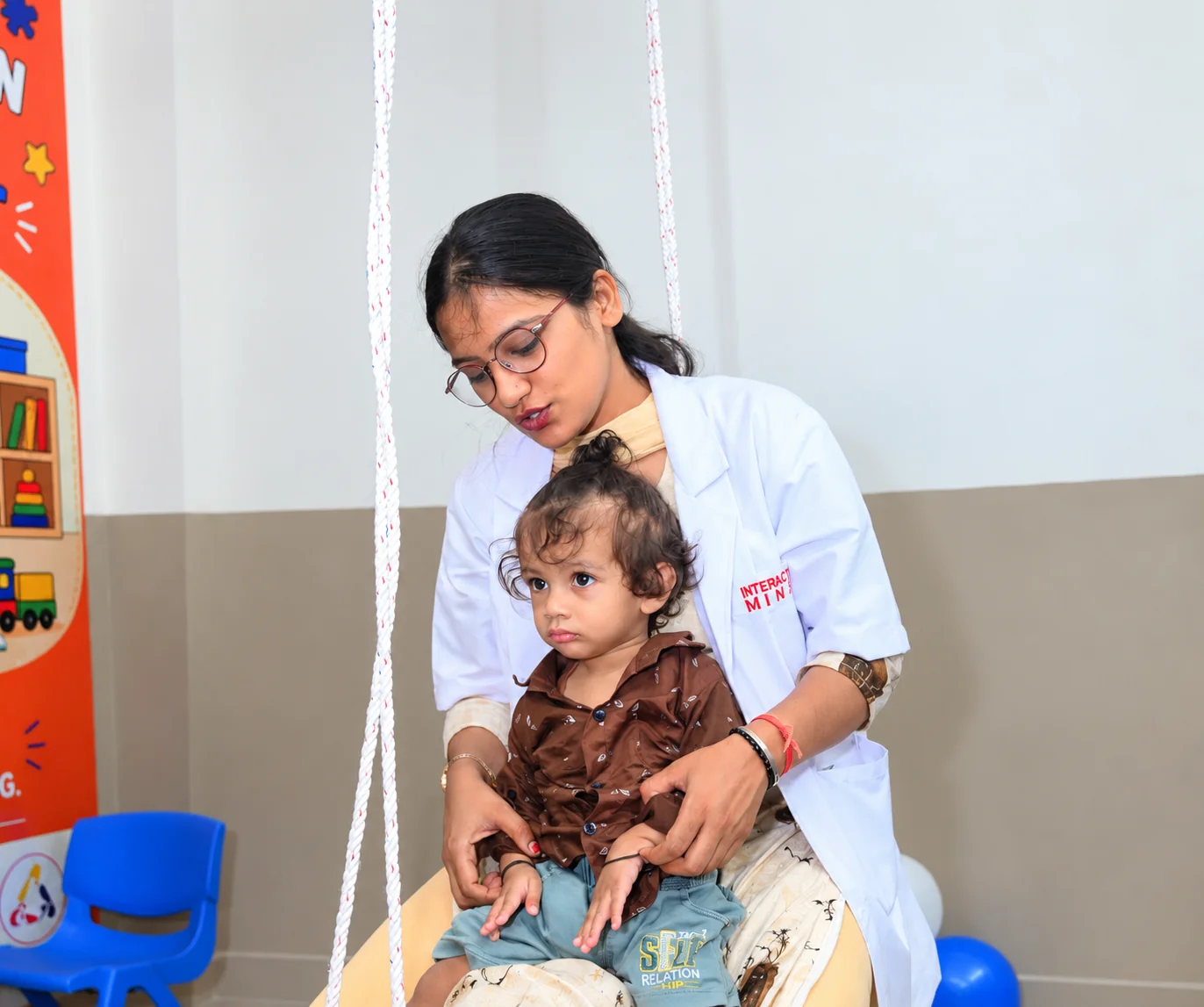 Child participating in a developmental activity with a caregiver